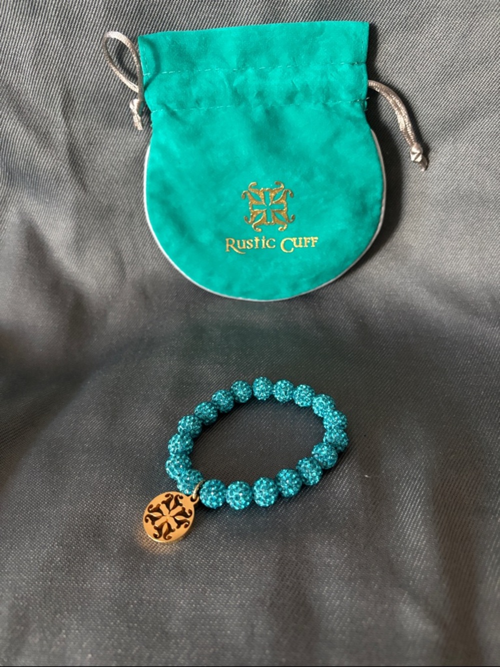 Rustic Cuff Teal Crystal Stretch Bracelet with Gold Logo Charm